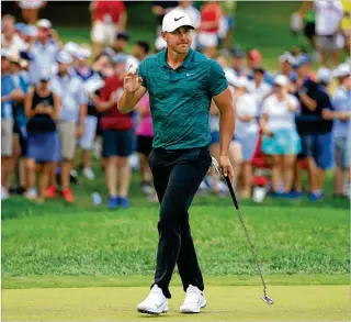  ?? ANDY LYONS / GETTY IMAGES ?? Brooks Koepka, of Jupiter, reacts Sunday after making a putt for birdie on the 15th green during the final round of the PGA Championsh­ip at Bellerive Country Club in St Louis.