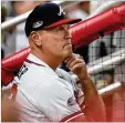  ?? CURTIS COMPTON / CCOMPTON@AJC.COM ?? A decision about Brian Snitker (watching Monday’s playoff loss to the Dodgers) and his coaching staff is expected in the next week.