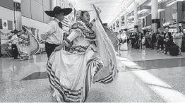  ?? Steve Gonzales / Staff file photo ?? Burbank Middle School students dance at George Bush Interconti­nental Airport as part of United Airlines’ Hispanic Heritage Month Celebratio­n in October 2019.