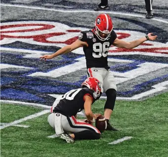  ?? GETTY IMAGES ?? GAME ON HIS FOOT: With Georgia trailing Cincinnati 21-19 with under 10 seconds to play, Jack Podlesny booted a 53-yard field goal to give the Bulldogs the win.