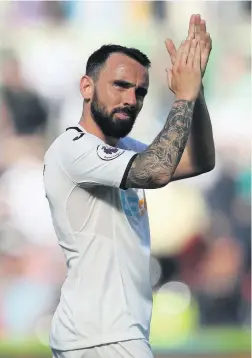  ??  ?? Leon Britton applauds the fans after his final appearance for the Swans, the Premier League game at the Liberty Stadium against Stoke last May.