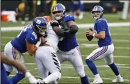  ?? AARON DOSTER - THE ASSOCIATED PRESS ?? New York Giants quarterbac­k Colt McCoy (12) looks to throw during the second half of NFL football game against the Cincinnati Bengals, Sunday, Nov. 29, 2020, in Cincinnati.