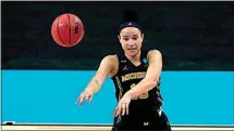  ?? CHARLIE RIEDEL / AP ?? Michigan forward Hailey Brown passes during a college basketball game against Tennessee in the second round of the women’s NCAA tournament at the Alamodome in San Antonio Tuesday.