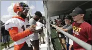  ?? TONY DEJAK — THE ASSOCIATED PRESS ?? Browns wide receiver Odell Beckham Jr. signs autographs after practice at the team’s training camp facility in Berea, Ohio, on Thursday.