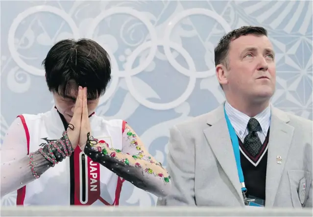  ?? IVAN SEKRETAREV/ THE ASSOCIATED PRESS ?? Yuzuru Hanyu of Japan reacts alongside his coach, Canadian Brian Orser, on Friday as he await results. Orser coached Hanyu to a gold medal in men’s fi gure skating at the Sochi Winter Olympics.