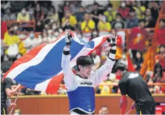  ?? ?? Taekwondo star Thanakrit Yodrak celebrates winning the men’s 58kg title.