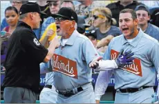  ?? Gene J. Puskar ?? The Associated Press Cubs manager Joe Maddon argues with umpire Jeff Kellogg over an apparent home run hit by Anthony Rizzo, right, that was called foul leading off Chicago’s 9-5 victory over the Pirates on Friday night at PNC Park.