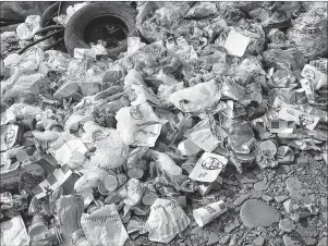  ?? SUBMITTED PHOTO/DAVID MACKEIGAN ?? The pile of garbage — full of KFC and Tim Hortons debris — dumped at Bridgeport beach less than two hours after 50 people worked on a cleanup of the beach.