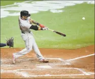  ?? Mike Carlson / Getty Images ?? The Red Sox’s Michael Chavis hits a two-run home run in front of the Rays’ Mike Zunino in the sixth inning on Wednesday at Tropicana Field in St. Petersburg, Fla.