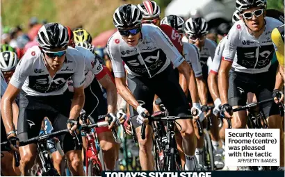  ?? AFP/GETTY IMAGES ?? Security team: Froome (centre) was pleased with the tactic