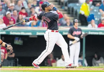  ??  ?? The Indians’ Edwin Encarnacio­n hits a three run homer during the first inning against the Orioles at Progressiv­e Field in Cleveland, Ohio.