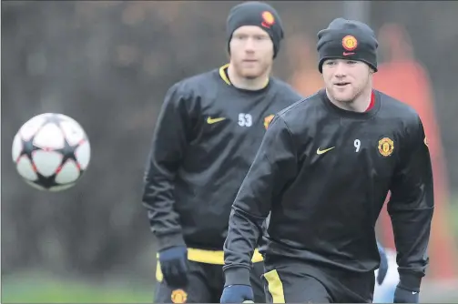  ?? GETTY ?? Not united: Wayne Rooney and Paul Scholes in training at Carrington. Rooney now says Scholes’ coaching role was exaggerate­d