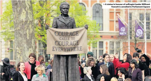  ??  ?? > A statue in honour of suffragist leader Millicent Fawcett is unveiled in Parliament Square