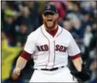  ?? MICHAEL DWYER — THE ASSOCIATED PRESS ?? Boston’s Craig Kimbrel reacts after striking out Houston’s George Springer to clinch the AL East championsh­ip in Boston on Saturday.