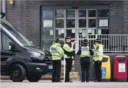  ?? PHOTOGRAPH: TOM MARTIN/WALES NEWS SERVICE ?? ▼ Police at Ysgol Dyffryn Aman yesterday. The school remained shut after the incident on Wednesday