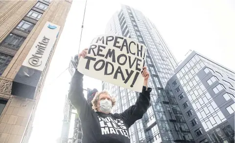  ?? BLOOMBERG ?? A demonstrat­or holds up a sign outside of Twitter headquarte­rs in San Francisco, California, on Monday.