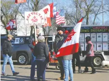  ?? JULIE KOTSIS ?? Anti-trudeau demonstrat­ors gather in Mic Mac Park on Monday. Attendees didn't appear keen to discuss what the protest was about.