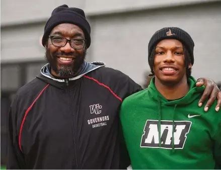  ?? Brian A. Pounds/Hearst Connecticu­t Media ?? Wilbur Cross assistant boys basketball coach Gerald McClease and his grandson, Christian, at the Robert Saulsbury Basketball Invitation­al Tournament at Hillhouse High School on Dec. 28.