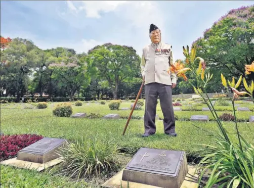  ?? RAJ K RAJ / HT PHOTOS ?? (Left) At the Imphal War Cemetery. Ninglam Tanghkhul, 90, is a veteran of the British Indian army that fought the Japanese in the Battle of Imphal and Kohima. “I went to war with 200 rounds of ammunition and a rifle.”