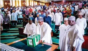  ??  ?? President Muhammadu Buhari lays the 2020 Budget proposal on the table, after presentati­on at the National Assembly in Abuja yesterday