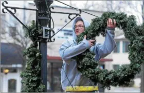  ?? DIGITAL FIRST MEDIA FILE PHOTO ?? For the past few years the Pottstown and Pottsgrove Air Force JROTC cadets have helped decorate the downtown Pottstown business district for the holidays.