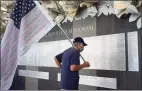  ?? Erik Trautmann / Hearst Connecticu­t Media file photo ?? Bridgeport resident Fred Haschak looks at the names on the indoor memorial as Connecticu­t holds the 19th annual 9/11 memorial ceremony on Sept. 10, 2020, at Sherwood Island State Park in Westport.