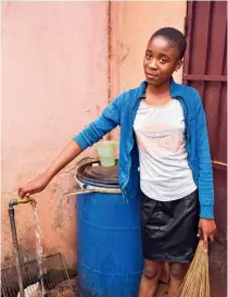  ?? ?? A girl fetches water in Bafoussam, Cameroon, on 2 March