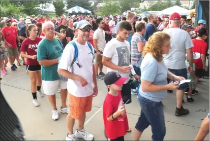  ?? Photo by Ernest A. Brown ?? Crowds stream into McCoy Stadium with mixed emotions Friday evening.