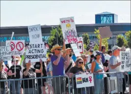 ?? Ben Botkin ?? Las Vegas Review-journal Protesters against President Donald Trump make their voices heard Wednesday outside the Reno-sparks Convention Center in Reno.