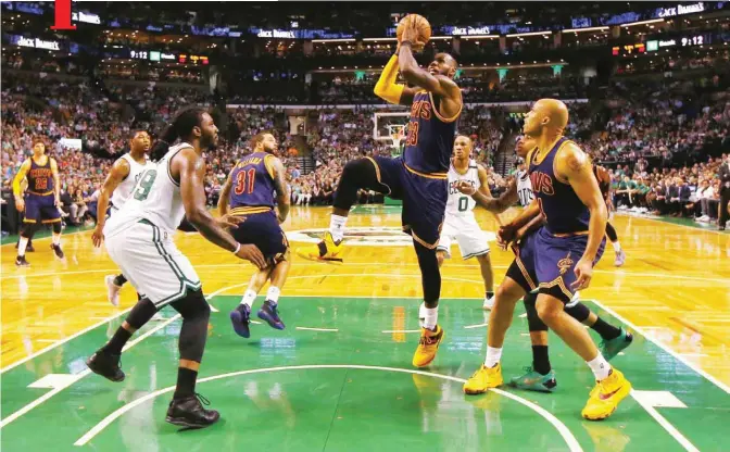  ?? —AFP ?? BOSTON: LeBron James #23 of the Cleveland Cavaliers drives to the basket in the first half against the Boston Celtics during Game Two of the 2017 NBA Eastern Conference Finals at TD Garden.