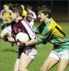  ??  ?? Derry Crowley (St. Martin’s) is tackled by Robert Black (HWH-Bunclody).