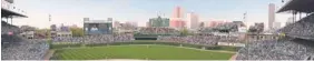  ?? | AP ?? A rendering provided by the Cubs shows a proposed scoreboard over left field and see-through sign in right.