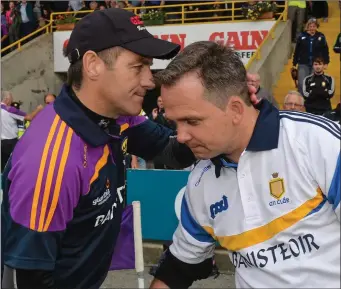  ??  ?? Liam Dunne has a consoling handshake for Davy Fitzgerald after Wexford’s replay win over Clare in Innovate Wexford Park two years ago which removed the All-Ireland holders from the championsh­ip.