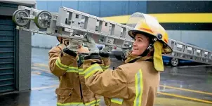  ?? DOMINICO ZAPATA/STUFF ?? Jensen is the only career female firefighte­r out of Hamilton’s three stations.