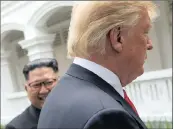  ?? PICTURE: REUTERS ?? US President Donald Trump and North Korea’s leader Kim Jong Un walk together before their lunch yesterday.