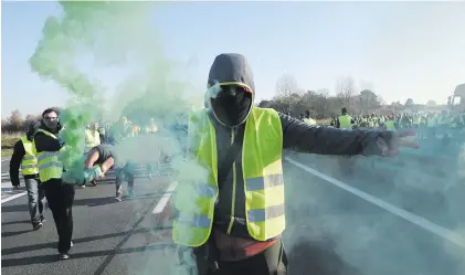  ?? Picture: AFP ?? DISAGREEME­NTS. French drivers seething over high fuel prices have vowed to snarl traffic across the country on Saturday in a widely supported protest that could prove the trickiest so far for French President Emmanuel Macron.
