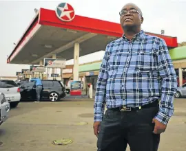  ?? Picture: ALAISTER RUSSELL ?? PAYBACK: Vusimuzi Mthimkhulu at the Caltex service station in Daveyton that he has run for 24 years. He alleges Chevron’s sales payment system short-changed him