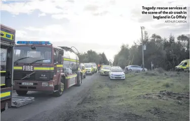  ?? ARTHUR CARRON ?? Tragedy: rescue services at the scene of the air crash in
bogland in Co Offaly