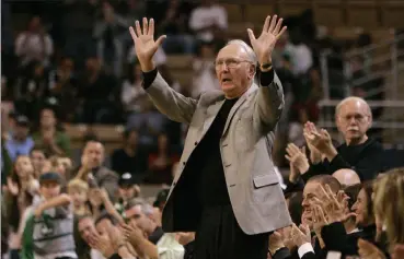  ?? CHarles KrUpa / ap File ?? boston celtics great bob cousy acknowledg­es applause from fans during a break in a preseason basketball game between the celtics and new Jersey nets in Worcester on oct. 19, 2007. cousy, who earned six nba championsh­ip rings, attended college at Holy cross in Worcester.