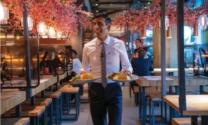  ?? Photograph: Simon Walker/HM Treasury ?? The chancellor, Rishi Sunak, serving customers at a Wagamama restaurant in London last week.