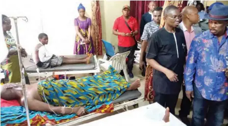  ??  ?? Gov. Willie Obiano of Anambra State (right) visits victims of the St. Philip Catholic Church, Ozobulu massacre