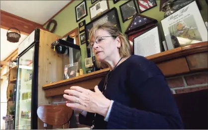  ?? Hearst Connecticu­t Media file photo ?? Pat Parry, mother of Brian Bill, a Stamford resident killed in Afghanista­n, discusses her son as a man and as a Navy SEAL during a sit-down with local veterans inside the Springdale Florist on May 23, 2016.