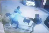  ??  ?? Video grab of the incident in which a youth was stabbed by three men in West Delhi on Thursday.