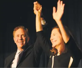  ?? Brian A. Pounds / Hearst Connecticu­t Media ?? Governor-elect Ned Lamont and Lt. Governor-elect Susan Bysiewicz celebrate their victory at Dunkin Donuts Park in Hartford on Nov. 7.