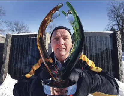  ?? CLIFFORD SKARSTEDT EXAMINER ?? David Edgerton, former Royal Canadian Legion Branch 52 president, has been awarded the June Callwood Award for his achievemen­ts in volunteeri­sm. He’s seen with the award Thursday at the Veterans Wall of Honour that he helped to spearhead.