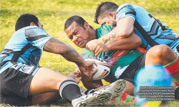  ??  ?? South Darwin’s Laisema Keresi is grounded by the Northern Sharks defence during NRL NT premiershi­p action at Goodline Park yesterday Picture: JUSTIN KENNEDY