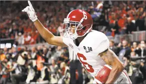  ?? David Goldman / Associated Press ?? Alabama wide receiver DeVonta Smith celebrates his touchdown during overtime of the college football playoff championsh­ip game against Georgia, in Atlanta in January.