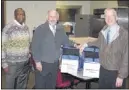  ??  ?? Colliervil­le Mayor Stan Joyner (center) spent a recent morning volunteeri­ng with MIFA volunteer David Cantry (right) and delivered meals to citizens who receive daily meals. They delivered meals to about 12 households and also checked on the well being...