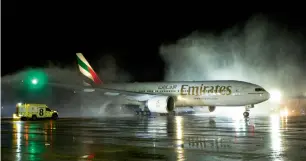  ?? Supplied photo ?? Emirates’ inaugural Boeing 777-200LR flight being welcomed at Comodoro Arturo Merino Benítez Internatio­nal Airport with a water cannon salute. —