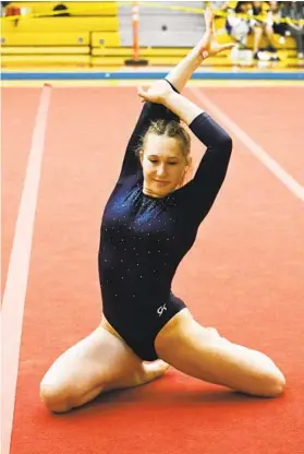  ?? DENIS POROY FOR THE U-T ?? La Costa Canyon’s Ashley Carroll competes in floor exercise during the all-around at the CIF gymnastics finals. Carroll finished in fifth place.